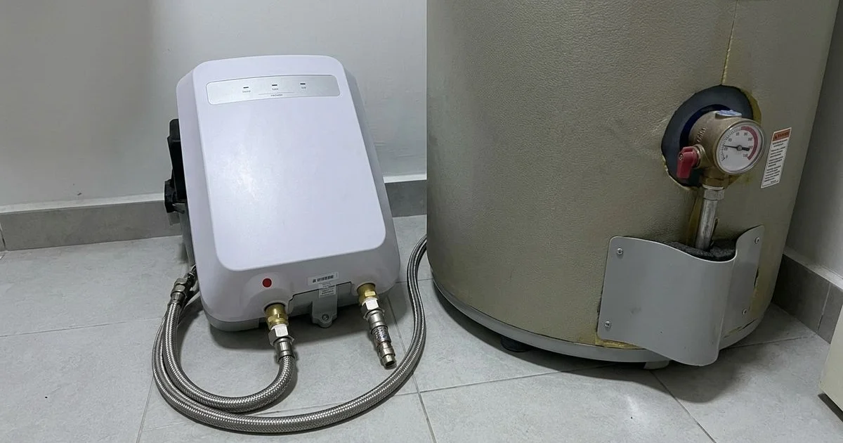 An instant water heater and a storage water heater shown side by side
